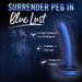 The Blush Surrender Intermediate 5.75 Inch Silicone Beginner & Pegging Dildo stands out with highlighted features: "Harness Compatible, Easy to Strap On, Shimmer in Blue Lust, Perfect for Pegging." Made from body-safe silicone for secure play. In the background, a couple embraces under the headline "Surrender Peg In Blue Lust.