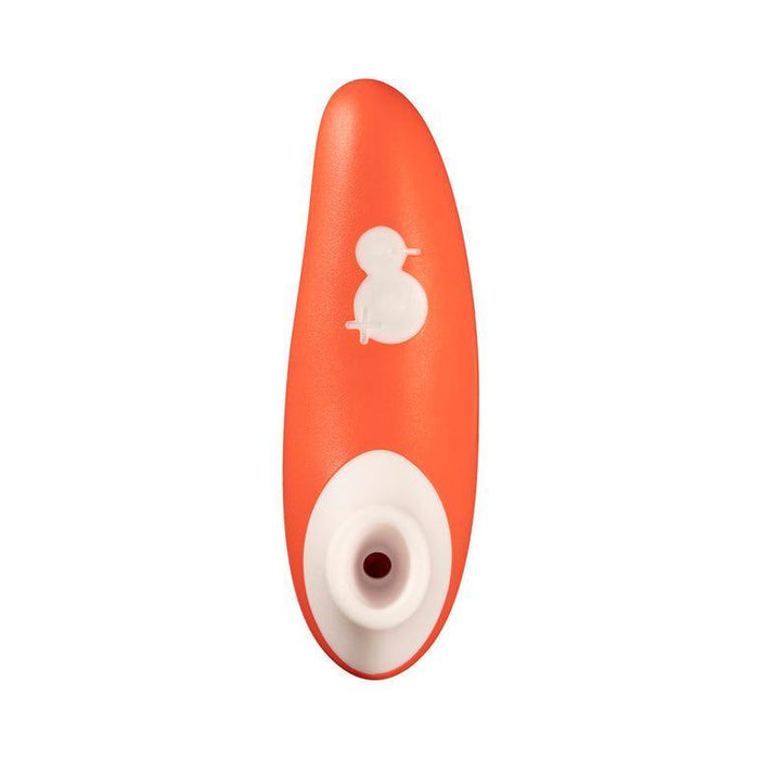 Image shows the WOW Switch Beginner's Pleasure Air Clitoral Stimulator, an orange and white device designed for personal care and pleasure. It features clitoral suction, a small circular button on the front, and a round opening at the bottom. The design is streamlined and ergonomic.