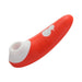 A WOW Switch Beginner's Pleasure Air Clitoral Stimulator in red with a white base features a sleek, curved design. The device has a circular opening at one end intended for targeted clitoral stimulation. Its smooth and streamlined surface makes it suitable for comfortable handheld use.