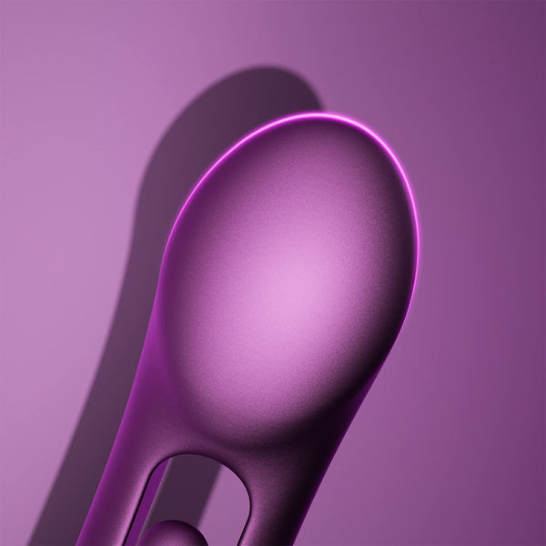 A close-up of the Tempo G-Spot Tapping Pressure Sensing App-Controlled Vibrator, featuring a smooth, purple, oval shape with a matte finish, is set against a matching purple background and soft shadow.