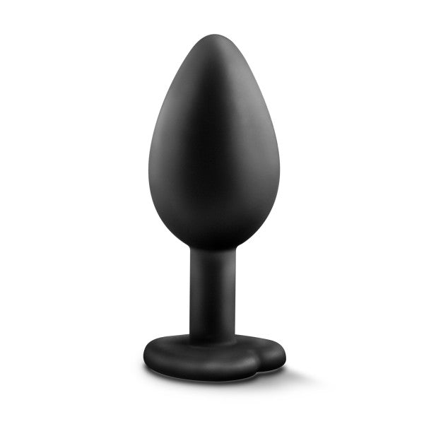The Temptasia Bling Small Silicone Butt Plug by Blush is a black plug featuring a tapered, bulbous tip and a heart-shaped, flared base for safe use. It boasts a satin smooth texture and is designed for adult use.