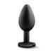 The Temptasia Bling Small Silicone Butt Plug by Blush is a black plug featuring a tapered, bulbous tip and a heart-shaped, flared base for safe use. It boasts a satin smooth texture and is designed for adult use.