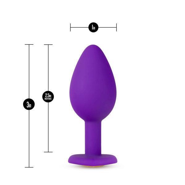Image of the Temptasia Bling Small Silicone Butt Plug - Purple by Blush with measurements displayed. Designed for beginner users, this butt plug is 3 inches long and has a maximum width of 1 inch, with the neck being 2.5 cm (approximately 0.98 inches) wide. The heart-shaped base ensures both comfort and safety during use.