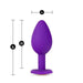 Image of the Temptasia Bling Small Silicone Butt Plug - Purple by Blush with measurements displayed. Designed for beginner users, this butt plug is 3 inches long and has a maximum width of 1 inch, with the neck being 2.5 cm (approximately 0.98 inches) wide. The heart-shaped base ensures both comfort and safety during use.