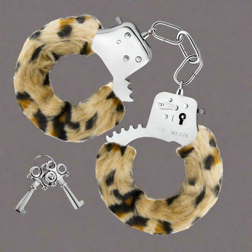 A pair of Temptasia Furry Cuffs Handcuffs with leopard print faux fur for role play, alongside a set of keys. (Blush)