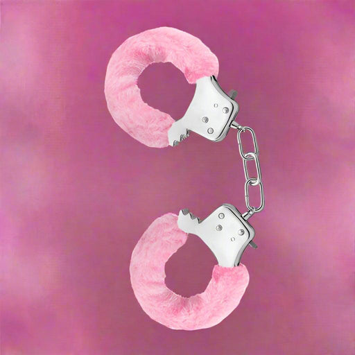 A pair of pink Blush Temptasia Furry Cuffs Handcuffs isolated on a white background.