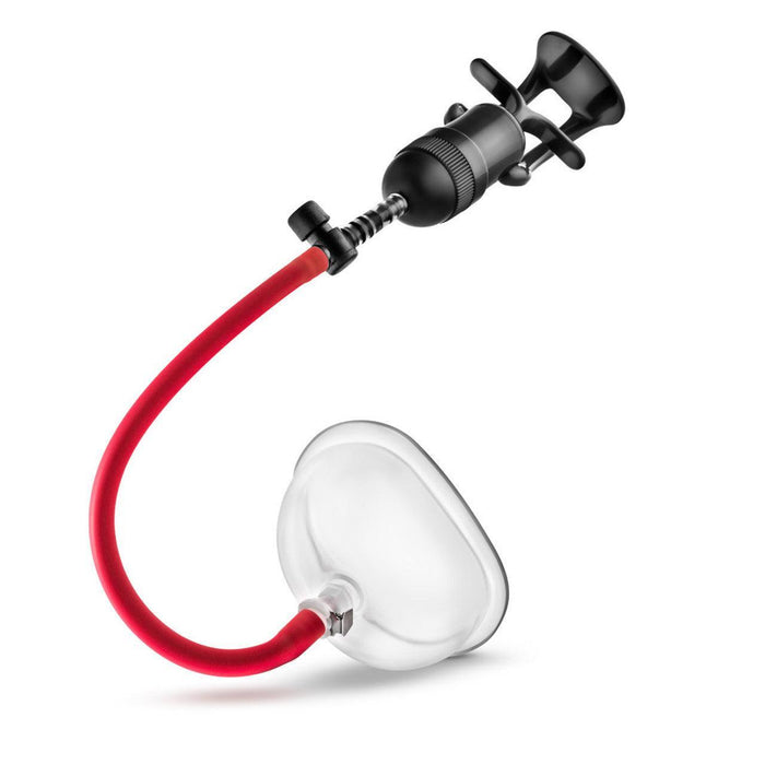 The image shows the Temptasia Intense Pussy Pump System by Blush, featuring a clear chamber and a contoured grip handle. While designed for vaginal use, its functionality is similar to that of a hand pump vacuum penis pump. The red tubing connects the black hand pump to the transparent cylindrical chamber used for enhancing blood flow.