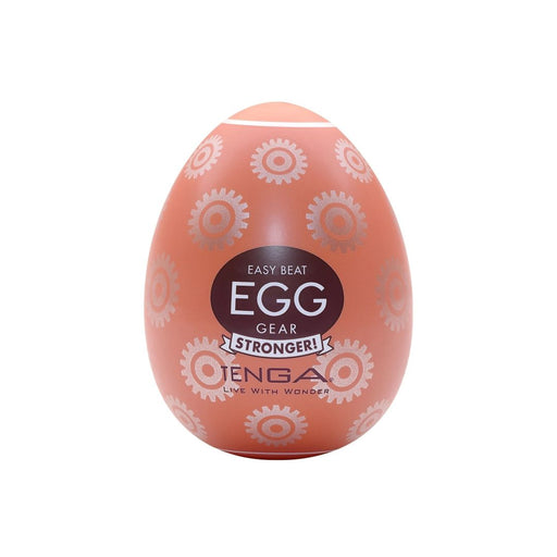 An orange, patterned Tenga Egg Disposable Penis Masturbator - Gear male pleasure device with the words "easy beat egg gear stronger" displayed on it, featuring a unique texture.