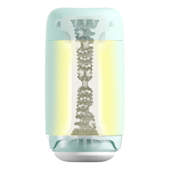 A Tenga Puffy Discreet Ultra Soft Beaded Masturbator - Mint Green in a mint green container with a translucent vertical section revealing the interior mechanism, which includes a central lattice structure and yellowish filter material. The base is wider with a white cap and an easy-to-clean silicone cover.