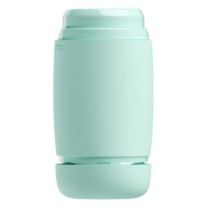 A sleek, cylindrical mint-green device with a minimalist design. The top section has a cap labeled "HEPA" and the bottom section is labeled "DRYING." The Tenga Puffy Discreet Ultra Soft Beaded Masturbator - Mint Green, featuring an ultra-soft spongy material for added comfort, stands upright on a flat surface.