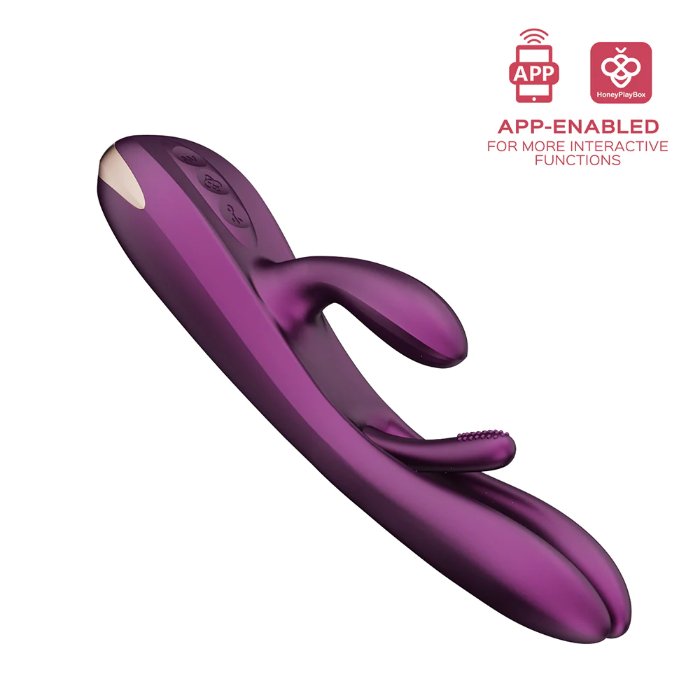The Terri App-Controlled Kinky Finger Tapping Rabbit Vibrator in purple from Honey Play Box boasts a curved design with control buttons, enabling dual-stimulation. The image also highlights icons for app compatibility and interactive functions, offering various vibrating modes for enhanced G-spot stimulation.