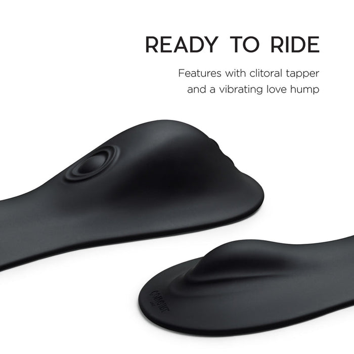 Close-up of the sleek, black silicone Cowgirl Rodeo Rumbler Grinding Sex Machine with raised features, clitoral tapper, and vibrating hump. Text above: "READY TO RIDE. Rideable pleasure machine for hands-free stimulation.