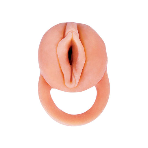 The Nasstoys "The Great Extender 2 in 1 7 Inch Penis Extender and Stroker - Vanilla" features a silicone replica of a realistic vaginal entrance attached to a ring. Viewed from above, the ring is designed to be held, providing a convenient handle for use. The product has a pale, skin-like color and boasts a smooth texture.