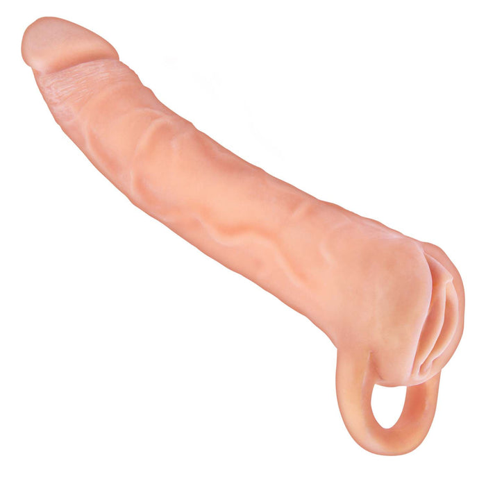 The Great Extender 2 in 1 7 Inch Penis Extender and Stroker by Nasstoys is a realistic, vanilla-toned silicone device that mimics the appearance of a penis. It features intricate details such as veins and a pronounced head, complemented by a loop at the base.