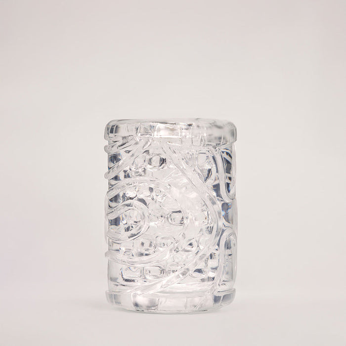 The Handy Mermaid Collection Coral Sleeve – Intense Sensations features a clear tumbler embossed with a swirling mermaid coral pattern, displayed upright against a simple light background.