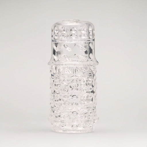 The Handy TrueGrip Gen 2 Sleeve features a longer, thicker textured design and stands upright against a plain, light background, highlighting its cylindrical shape and enhanced grip pattern on the rounded cap.