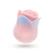 The Kissing Rose Vibrator with Tongue and Lips features a pastel pink and blue rosebud design, made from body-safe silicone with two front buttons, shown on a white background.