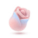 The Kissing Rose Vibrator with Tongue and Lips, in pink and light blue body-safe silicone, features a rose shape with petal-like edges and visible control buttons, shown against a white background.