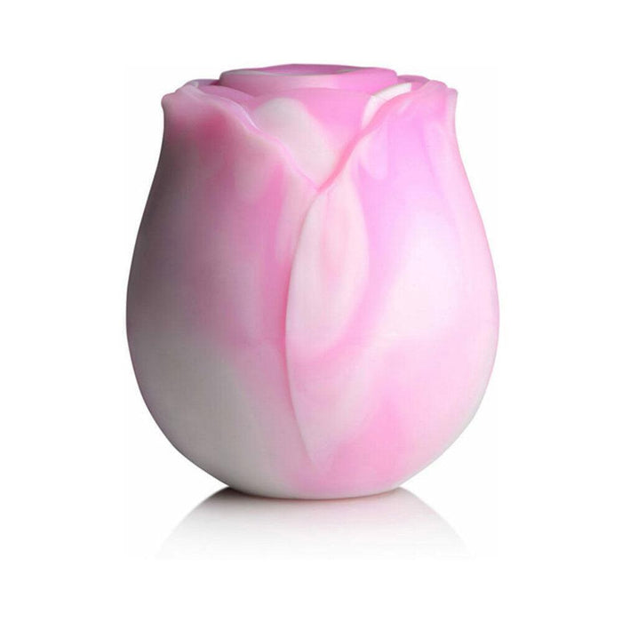 The Rose Dream Pink Swirl Powerful Clitoral Stimulator by XR Brands is elegantly designed with a smooth, glossy surface reminiscent of delicate pink and white rose petals, set against a plain white background.