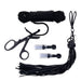 A collection of black BDSM gear including rope, scissors, two small transparent nipple suckers, and a flogger from the Tied and Twisted Bondage Set by Sportsheets, arranged neatly on a white background.