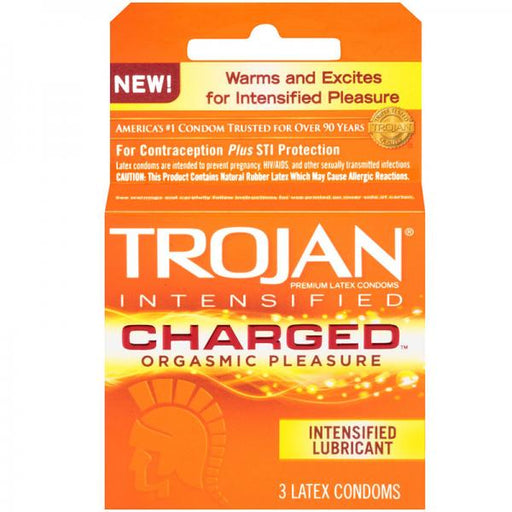 An orange and yellow package of Paradise Marketing's Trojan Charged W/intensified Lubricant Condoms advertising "warming lubricant" for "orgasmic pleasure", containing 3 latex condoms.