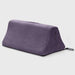 The Liberator Tula – Dual-Toy Sex Cushion is a purple, wedge-shaped pillow with a soft fabric cover, handle, and black "Liberator" tag. Ergonomically designed for pleasure, it discreetly mounts two toys on a plain light gray background.