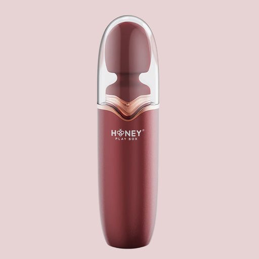 Discover the sleek Stormi Powerful Heating Wand Vibrator from Honey Play Box. This red personal massager boasts 9 vibration patterns and a deep rumbling motor, combined with an ergonomic shape for optimal comfort. It features a translucent cap that covers the top half, offering both modern and minimalist aesthetics.