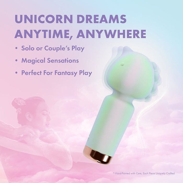 The Unicorn Dreams Mini Wand – Magical Pleasure Awaits, crafted from body-safe silicone in pastel hues, is displayed on a dreamy pink and purple background, with text highlighting magical solo or couple’s play and fantasy sensations.