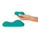 A hand holds a small teal wireless remote above the VibePad Intense Ultra Powerful Ride On Hands-Free Humping Vibrator, both in matching teal with a wave-like shape, set against a white background.