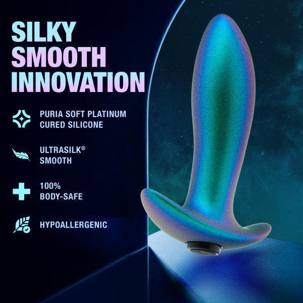 The Voyager Smooth Vibrating Butt Plug & Prostate Massager by Blush is beautifully presented against a dark blue backdrop. Features highlighted in the text include its Puria soft platinum cured silicone composition, Ultrasilk smooth texture, and 100% body-safe and hypoallergenic properties.