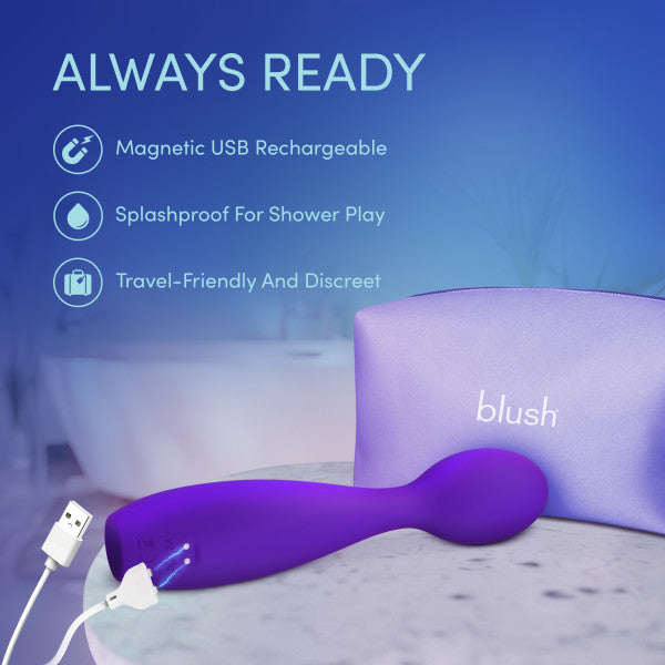 The Velvet High Versatile Internal or External Vibrator with Flexible Neck in purple sits on a bathroom counter, featuring magnetic USB recharge, splashproof design, and travel-friendly portability—ideal for clitoral or internal stimulation.