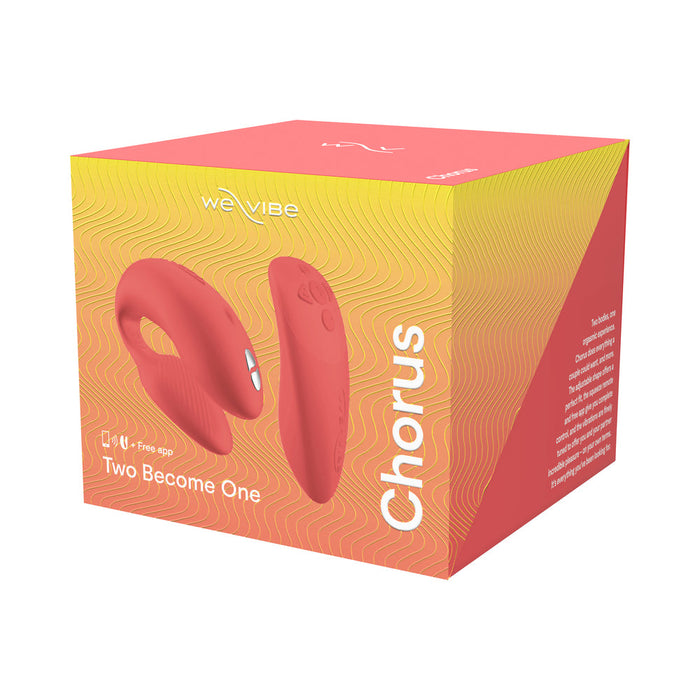 A red and orange box with wavy patterns displays the We-Vibe Chorus Remote & App Controlled Couples' Vibrator - Coral. The text reads “Two Become One,” highlighting its adjustable fit and app compatibility.