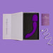 A purple Wellness Dual Sense Double Ended Ergonomic Waterproof Wand by Blush is neatly placed inside an open box with a foam insert. Next to the box is a USB charging cable and a small purple booklet labeled "Wellness." The background has a shade of purple that perfectly matches the massager.