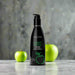 A black bottle of Wicked Lubes' Wicked Aqua Candy Apple Flavored Water Based Lubricant, featuring a 2 fl. oz. capacity, minimalist green apple graphics, and a convenient pump dispenser at the top.