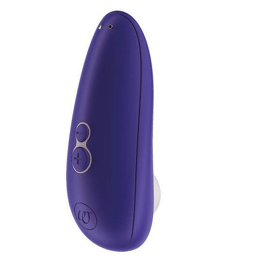 The Womanizer Starlet 3 Pleasure Air Clitoral Stimulator in Indigo is a sophisticated handheld electronic device with an elegant curved design, featuring two control buttons and a small LED indicator. It includes a white circular attachment at the bottom for clitoral stimulation, delivering specific functionality. This product is ideal for individuals seeking an innovative experience with Pleasure Air Technology.