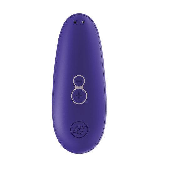 The Womanizer Starlet 3 Pleasure Air Clitoral Stimulator - Indigo by Womanizer is a sleek, oval-shaped, purple handheld electronic device. It features two small circular buttons labeled with plus and minus symbols, and utilizes Pleasure Air Technology for clitoral stimulation. The device is USB rechargeable and has a small emblem at the bottom with two tiny holes at the top.