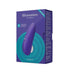 The image displays the packaging for the "Womanizer Starlet 3 Pleasure Air Clitoral Stimulator - Indigo" from Womanizer. The box features an image of the product, a compact indigo device with buttons, and text detailing its features, including "Pleasure Air Technology" for clitoral stimulation, USB recharging capability, and waterproof design.