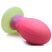 The XR Brands' Xeno Egg Glow In The Dark Silicone Egg is showcased against a white background. This playful toy features a textured, bulbous design with a bright green base and a main body that beautifully transitions from purple to pink. Crafted from premium silicone, this squishy and flexible butt plug glows in the dark for added fun.