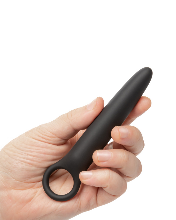 Calex Boundless Dilator held by a hand on a white background