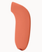 Dame Aer Clitoral Pressure Wave Vibrator - Papaya alone on a light pink background