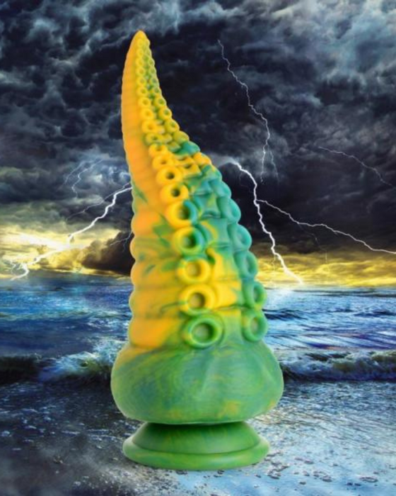 Monstropus Tentacled Monster 8.5 Inch Silicone Dildo standing upwards on a stormy landscape