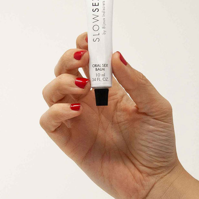 Bijoux Indiscrets Slow Sex Oral Sex Balm model holding in hand