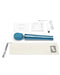 A blue Le Wand Petite Massager, made of body-safe silicone and accompanied by various accessories, including a charging cable, user manual, and a storage pouch, neatly displayed on a white.