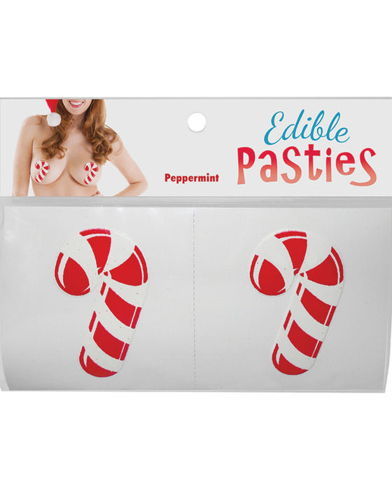 The image displays a package of Christmas Candy Cane Edible Nipple Pasties by Kheper Games with a peppermint design, suggestive of a playful, novelty adult accessory.