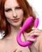 Double Thump 7X Rechargeable Silicone Double Dildo in the bent u position  held by a model 
