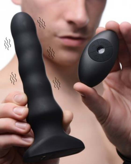 Thunderplugs Vibrating & Squirming Silicone Plug with Remote Control held by male model
