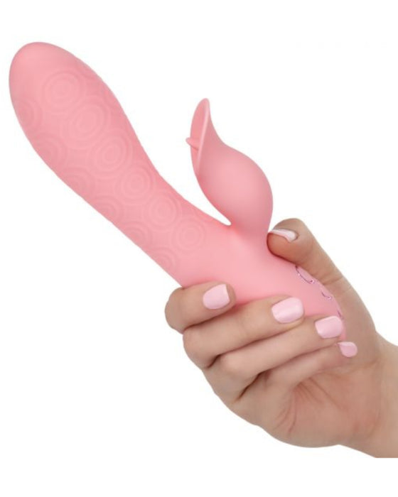 California Dreaming Pasadena Player Waterproof G-Spot Rabbit Vibrator held in a person's hand to illustrate the size of the vibrator
