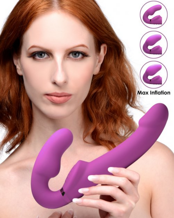 10x Evoke Ergo Fit Inflatable And Vibrating Silicone Strapless Strap-on held by a female model