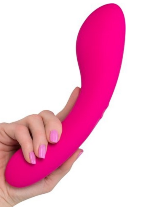 Swan Wand Powerful Double Ended Vibrator - Pink held in a person's hand by the smaller end