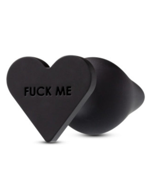 Temptasia Fuck Me Silicone Heart Butt Plug showing the writing on the base